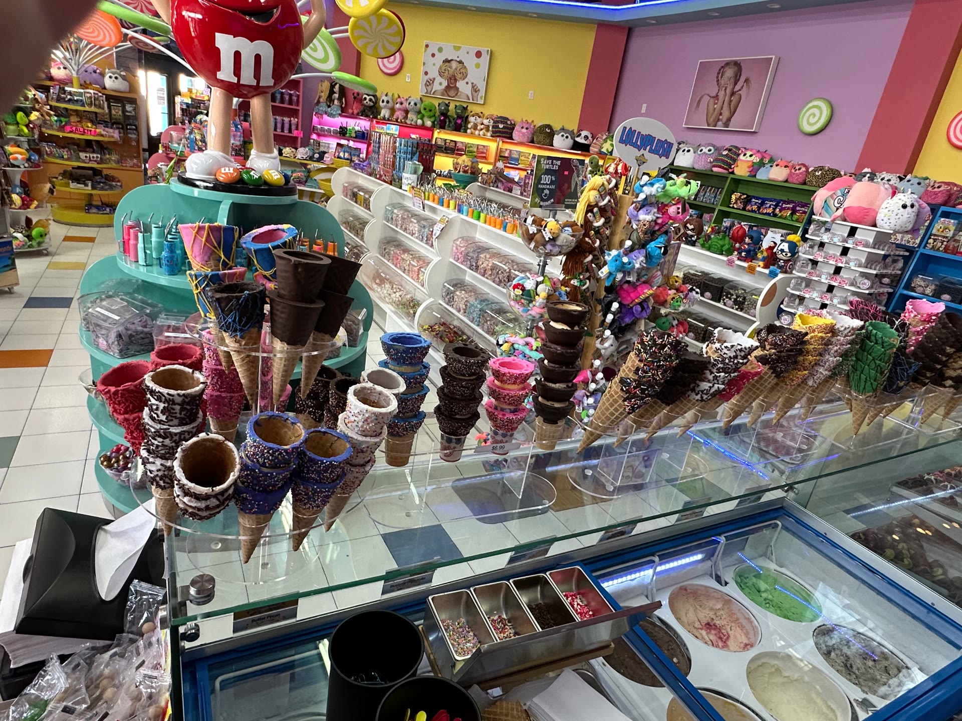 Island Candy South Padre Island interior with M&M mascot, hand-dipped waffle cones, and candy wall